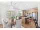 Well-equipped kitchen with stainless steel appliances and a dining area with access to the patio at 2070 Mustang Chase Dr, Carmel, IN 46074