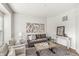 Comfortable living room featuring modern decor, neutral colors, and a decorative area rug at 2070 Mustang Chase Dr, Carmel, IN 46074