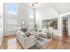 Open concept living room with vaulted ceiling, fireplace, and an abundance of natural light at 2070 Mustang Chase Dr, Carmel, IN 46074