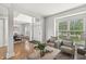 Inviting living room with a view of the dining area and front entrance, highlighting an open floor plan at 2070 Mustang Chase Dr, Carmel, IN 46074