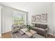 Bright living room features modern decor, comfortable seating, and a decorative area rug at 2070 Mustang Chase Dr, Carmel, IN 46074