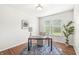 Well-lit office space featuring hardwood floors, a modern desk and views of the outside at 2070 Mustang Chase Dr, Carmel, IN 46074