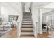 Stairway with hardwood treads that leads to the main living area at 2070 Mustang Chase Dr, Carmel, IN 46074