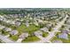Areal view of suburban homes with mature tree coverage, ponds, and winding streets at 2337 Hanover Rd, Brownsburg, IN 46112