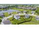 Aerial view showing a home with a backyard fire pit and a pond in a cozy neighborhood at 2337 Hanover Rd, Brownsburg, IN 46112