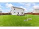 Expansive backyard with a brick firepit, outdoor seating, and a lush lawn, perfect for recreation at 2337 Hanover Rd, Brownsburg, IN 46112