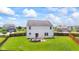 Spacious backyard featuring a patio with a built-in fire pit, perfect for outdoor entertaining at 2337 Hanover Rd, Brownsburg, IN 46112