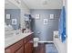 Bathroom featuring a double vanity, framed mirror, and shower over tub at 2337 Hanover Rd, Brownsburg, IN 46112
