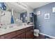 This bathroom features a double vanity, framed mirror, and updated fixtures at 2337 Hanover Rd, Brownsburg, IN 46112