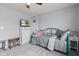 Bedroom featuring a carpet, ceiling fan, bed, dresser, and tv at 2337 Hanover Rd, Brownsburg, IN 46112