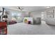 Light-filled bonus room offers versatile living space and neutral carpeting at 2337 Hanover Rd, Brownsburg, IN 46112