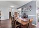 An inviting dining room features dark wood flooring and a modern color scheme at 2337 Hanover Rd, Brownsburg, IN 46112