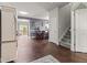 Spacious entryway featuring hardwood floors, leading to the dining area and staircase at 2337 Hanover Rd, Brownsburg, IN 46112