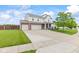 Traditional two-story home with two car garage, brick accents, and inviting front porch at 2337 Hanover Rd, Brownsburg, IN 46112