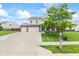 Well-maintained two-story home with a two-car garage, brick details, and a spacious driveway at 2337 Hanover Rd, Brownsburg, IN 46112