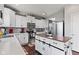 Well-equipped kitchen with white cabinets, stainless steel appliances, and a center island at 2337 Hanover Rd, Brownsburg, IN 46112