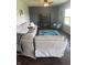 Comfortable living room featuring a large sectional sofa, dark accent wall, and blue area rug at 2337 Hanover Rd, Brownsburg, IN 46112