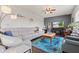 Comfortable living room showcasing a plush sofa, modern lighting, and stylish decor at 2337 Hanover Rd, Brownsburg, IN 46112