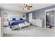 A stylish main bedroom features a blue accent wall and a large ceiling fan at 2337 Hanover Rd, Brownsburg, IN 46112