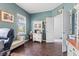 Cozy home office with a built-in cabinet, natural light, and a comfortable seating area at 2337 Hanover Rd, Brownsburg, IN 46112
