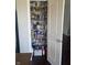 Organized pantry featuring shelves stocked with various food items and supplies at 2337 Hanover Rd, Brownsburg, IN 46112