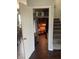 View of a hall closet full of organized storage with access to attic space at 2337 Hanover Rd, Brownsburg, IN 46112