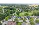 An aerial view shows homes in a residential neighborhood adjacent to a golf course and pond at 241 Chamberlain Cir, Noblesville, IN 46062