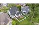 Aerial view of a property showcasing a well-kept lawn, patio area, and surrounding greenery at 241 Chamberlain Cir, Noblesville, IN 46062
