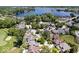 An aerial view shows a residential neighborhood with a golf course and lake in the background at 241 Chamberlain Cir, Noblesville, IN 46062