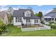 Inviting backyard with well-maintained lawn, white fence, and a delightful outdoor seating area at 241 Chamberlain Cir, Noblesville, IN 46062