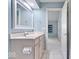 Bathroom featuring a white sink vanity, framed mirror, and soft blue accent walls at 241 Chamberlain Cir, Noblesville, IN 46062