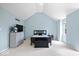 Spacious bedroom with a vaulted ceiling, light blue walls, carpet and modern decor at 241 Chamberlain Cir, Noblesville, IN 46062