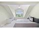 Bedroom featuring vaulted ceilings, a ceiling fan, a window seat, and neutral-colored walls at 241 Chamberlain Cir, Noblesville, IN 46062