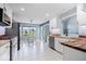 Kitchen area features stainless steel appliances, butcher block countertops, and large window views at 241 Chamberlain Cir, Noblesville, IN 46062
