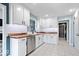 Bright kitchen with stainless steel appliances, white cabinetry, and butcher block countertops at 241 Chamberlain Cir, Noblesville, IN 46062