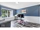 Comfortable home office with ample natural light, modern desk, and stylish decor at 241 Chamberlain Cir, Noblesville, IN 46062