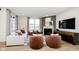 Bright living room featuring a cozy fireplace, comfortable seating, and large windows at 2598 Penn Ave, Plainfield, IN 46168
