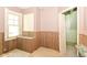 Bedroom featuring wood paneling and natural light from the window that would be great for storage or a small bedroom at 31 E Mill St, New Palestine, IN 46163
