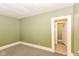 Cozy room with an attached closet and green walls at 31 E Mill St, New Palestine, IN 46163