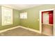 Bright bedroom with a window and doorway providing ample natural light and accessibility at 31 E Mill St, New Palestine, IN 46163