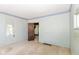 View of a bedroom showing an adjacent walk-in closet and exterior door at 31 E Mill St, New Palestine, IN 46163