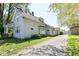 Image of the exterior and driveway, showing home and yard at 31 E Mill St, New Palestine, IN 46163