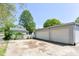 Spacious two-car detached garage with a concrete driveway and ample parking space at 31 E Mill St, New Palestine, IN 46163
