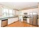 Spacious kitchen with stainless steel appliances, plenty of cabinet space, and natural light at 31 E Mill St, New Palestine, IN 46163