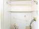 Bright laundry room with built-in white shelving, perfect for organizing and storing all your laundry needs at 31 E Mill St, New Palestine, IN 46163