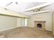 View of the living room and doorway, fireplace, and ceiling fan at 31 E Mill St, New Palestine, IN 46163