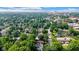 Scenic aerial view showcasing a residential area with tree-lined streets and a distant city skyline on a clear day at 3215 N Pennsylvania St, Indianapolis, IN 46205