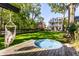 Well-manicured backyard with hot tub and lounging hammock at 3215 N Pennsylvania St, Indianapolis, IN 46205