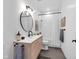 Modern bathroom featuring a floating wood vanity, black fixtures, and a bright, minimalist design at 3215 N Pennsylvania St, Indianapolis, IN 46205