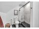 Chic bathroom with a marble tiled shower, black fixtures, and a modern toilet at 3215 N Pennsylvania St, Indianapolis, IN 46205